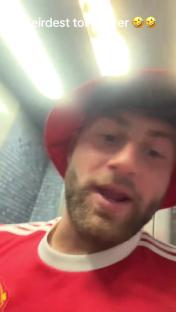 A Manchester United fan in a restroom.