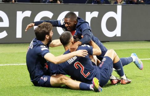Paris Saint-Germain players celebrating a goal.