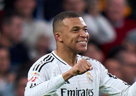 Kylian MbappÃ© of Real Madrid celebrating a goal.