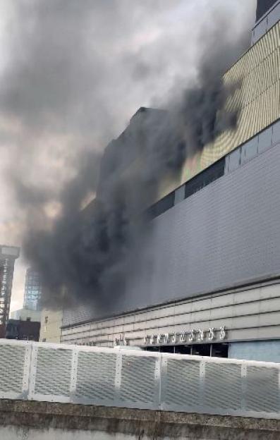 Smoke billowing from Westfield Stratford City during an evacuation.