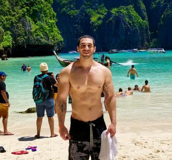 Portrait of a man in a black shirt.