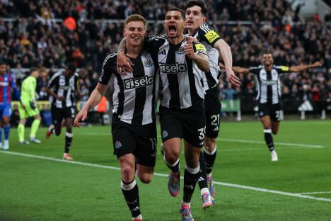 Newcastle United players celebrating a goal.