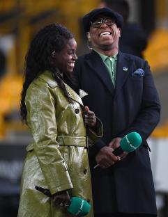 Eni Aluko and Ian Wright sharing a joke while working for ITV Sport.