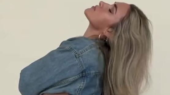 World’s sexiest volleyball star Kayla Simmons shows off sideboob as she goes braless in denim jacket