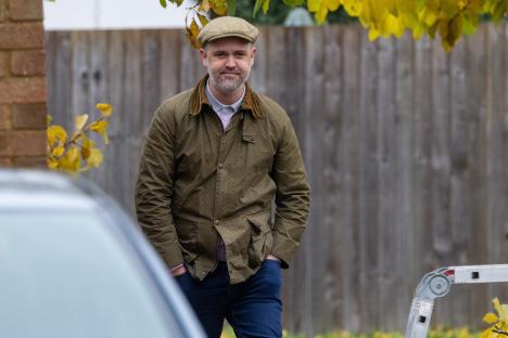 Daniel Hill, Storage Hunters star, wearing a flat cap and olive jacket.