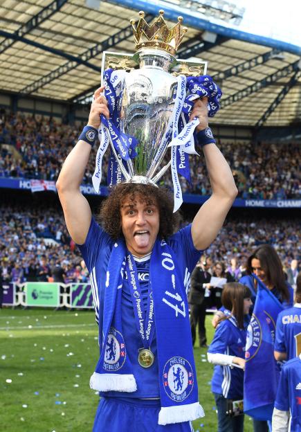 David Luiz of Chelsea celebrating with the Premier League trophy.