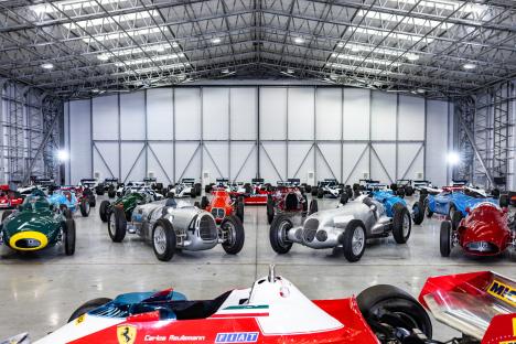 Collection of classic red Formula One race cars.