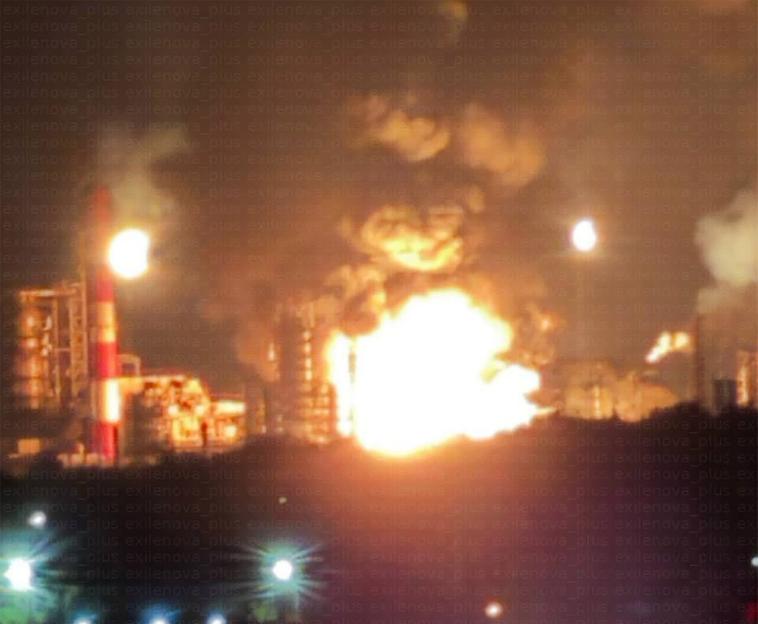 Burning oil refinery.