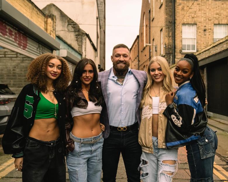 Conor McGregor posing with four women.