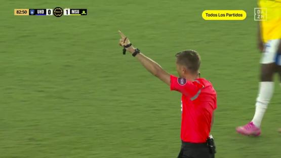 Referee signaling a corner kick during a Club World Cup match.