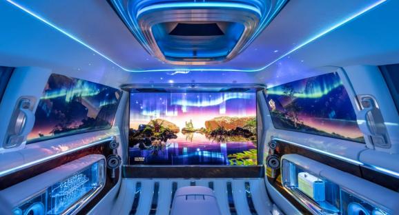 Interior of Mercedes Vision V Concept with aurora borealis displayed on screens.