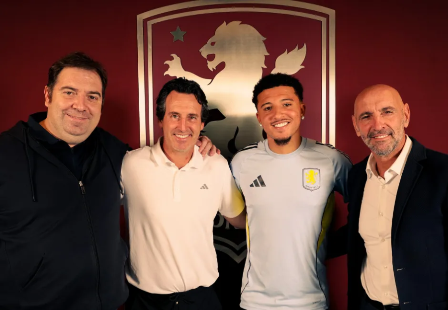 Four men posing for a photo.