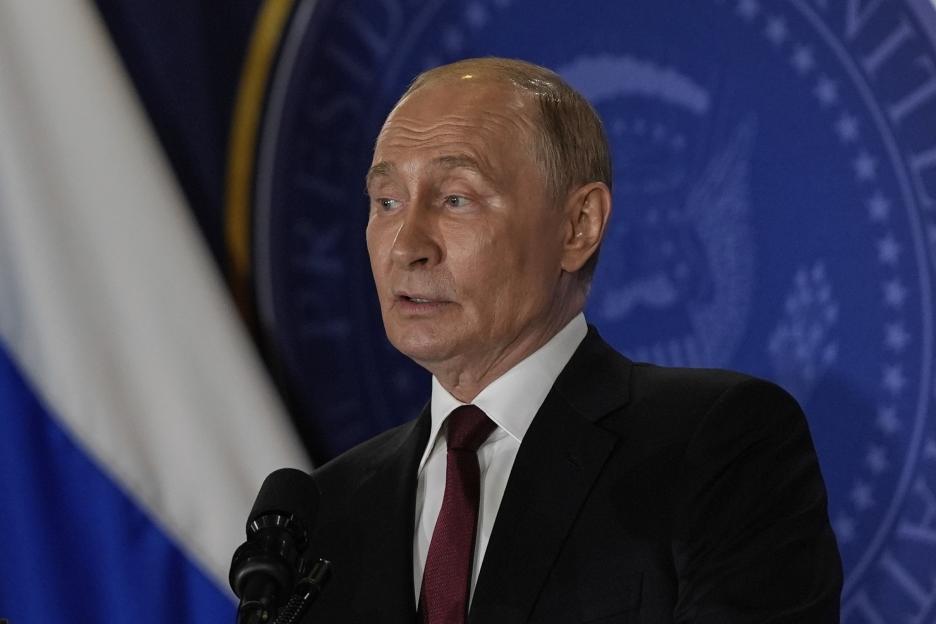 Vladimir Putin speaking at a press conference.