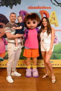 James Haskell, his daughter, and Charlotte Crosby posing with Dora the Explorer.