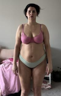 Woman in pink bra and light green underwear.