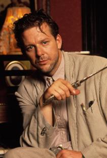 Mickey Rourke holding a knife, promotional still from *Angel Heart*.
