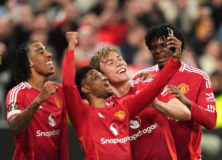 Manchester United players celebrating a goal.