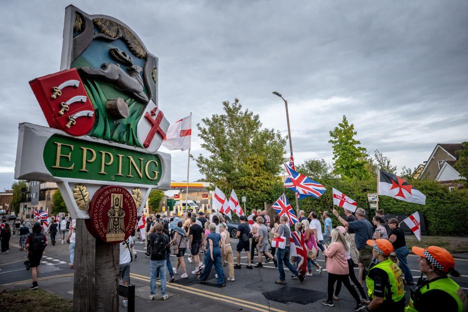 Anti-migrant protesters march in Epping, UK.