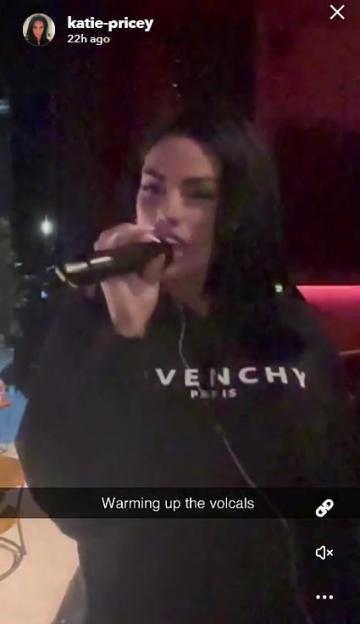 Katie Price warming up her vocals.