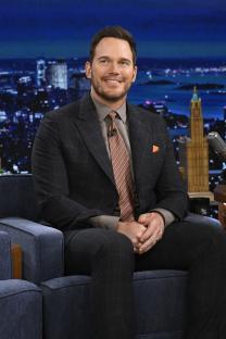Chris Pratt in a suit during an interview on The Tonight Show Starring Jimmy Fallon.