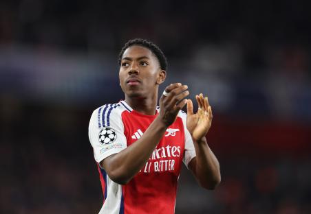 Myles Lewis-Skelly of Arsenal applauding during a Champions League match.