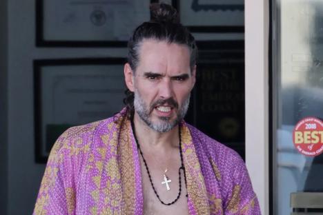 Russell Brand charged by post in Florida as he tells cops he WILL return to UK to face rape & assault allegations