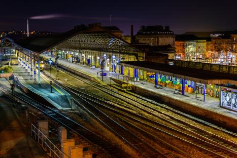 Huddersfield railway station at night.