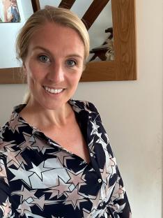 Woman wearing a star-print shirt.