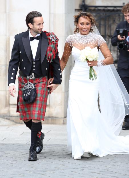 Mel B and her husband leaving St. Paul's Cathedral after their wedding.
