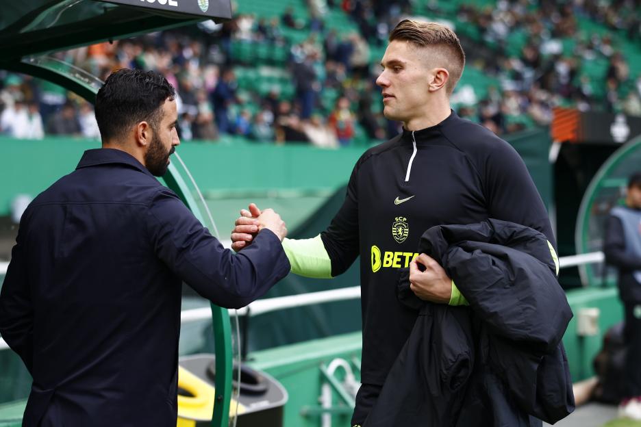 Ruben Amorim and Viktor Gyokeres shaking hands at a Sporting CP soccer match.