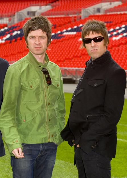 Liam and Noel Gallagher of Oasis at a press conference.