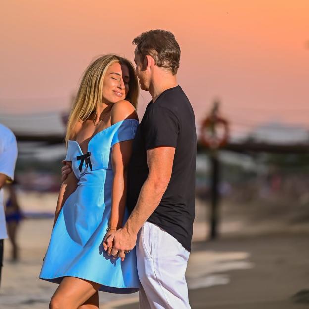 Stacey Solomon and her partner holding hands.