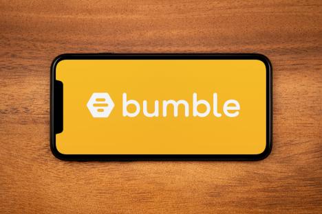 Smartphone displaying the Bumble app logo and name.