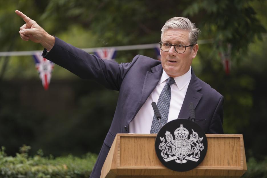 Under-fire PM says he’ll close migrant hotels early, but can’t say when – as he brands Farage’s migrant plan ‘unfair’