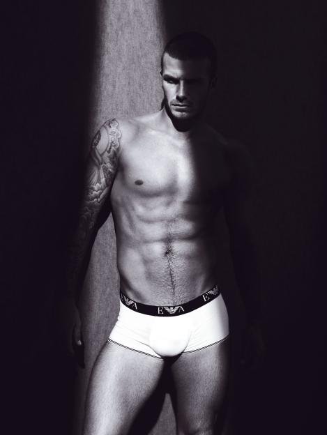 Black and white photo of David Beckham in Armani underwear.
