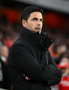 Mikel Arteta, Arsenal manager, looking on.