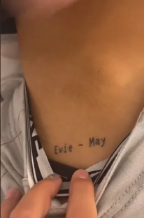 Neck tattoo that reads 