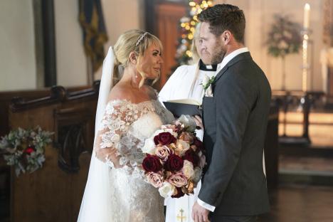 A bride and groom exchanging vows in a church.