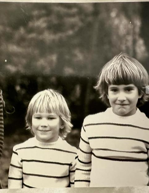 Black and white photo of two young children.