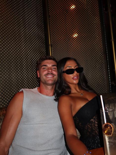 Harry Cooksley and Shakira sitting together.