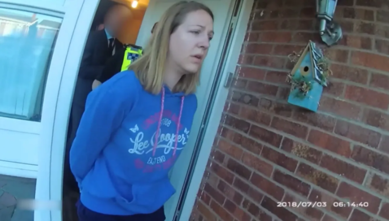 Woman in handcuffs being arrested at her front door.