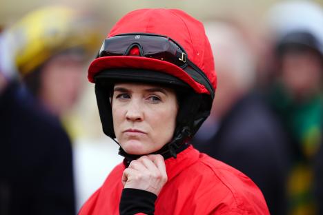 Rachael Blackmore in a red jockey's jacket and helmet.