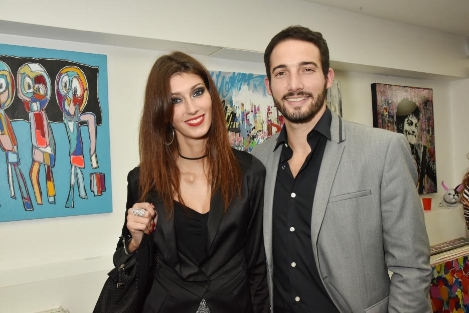Sophie Vouzelaud and Fabien Boutamine at an art gallery.