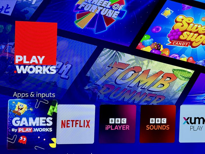 Smart TV screen displaying various apps and games, including Playworks games.