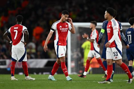 Arsenal's William Saliba looking dejected after a soccer match.