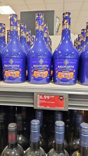 Ballycastle Honeycomb Cream Liqueur bottles on a store shelf.