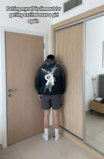 Man standing in timeout for getting excited over a girl.