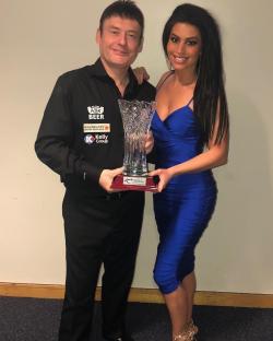 Jimmy White with a woman holding a trophy.