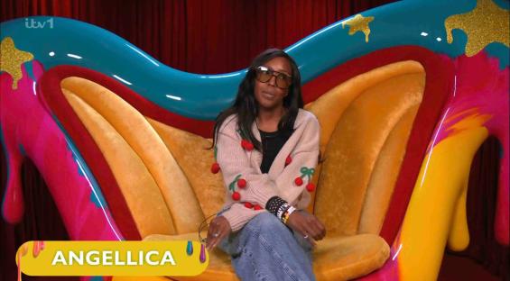 Angelica Bell sitting in a brightly colored chair.