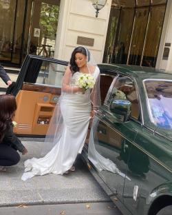 Melanie Kamayou, wife of goalkeeper Andre Onana, getting into a car in a wedding dress.